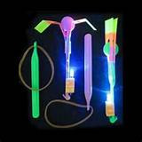 Wholesale LIGHT UP SLING SHOT SPINNING UMBRELLA SHOOTERS (Sold by the piece or dozen) *- CLOSEOUT 50 CENTS EA